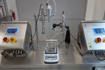 Experimental setup for dosing e-liquids with a dispenser with a circulation nozzle Experimental setup for dosing e-liquids with a dispenser with a circulation nozzle