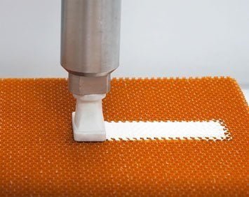 Automated honeycomb potting with a 1-component material from Von Roll Automated honeycomb potting with a 1-component material from Von Roll