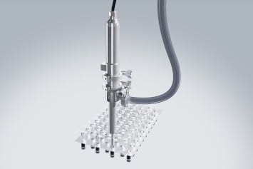 Syringe filling systems for medium to high viscosity fluids and pastes